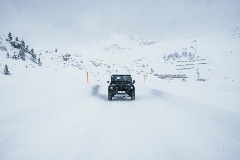 The Ineos Grenadier 4x4 SUV, designed to replace the Land Rover Defender, driving through snow in Austria.