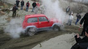 A Lada Niva 4x4 SUV shows off its capability.