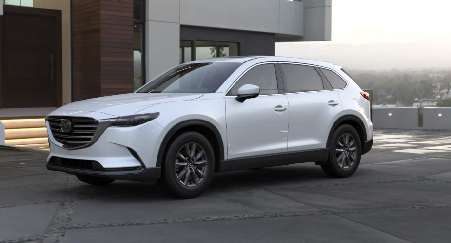 A white 2023 Mazda CX-9 midsize SUV is parked, is it a good alternative to the Telluride?