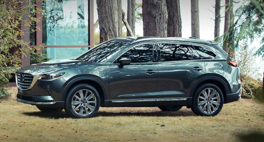 A gray 2023 Mazda CX-9 midsize SUV is parked. 