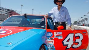 NASCAR Hall of Famer Richard Petty with a replica of his #43 STP Pontiac at the WWT Raceway in Madison, Illinois