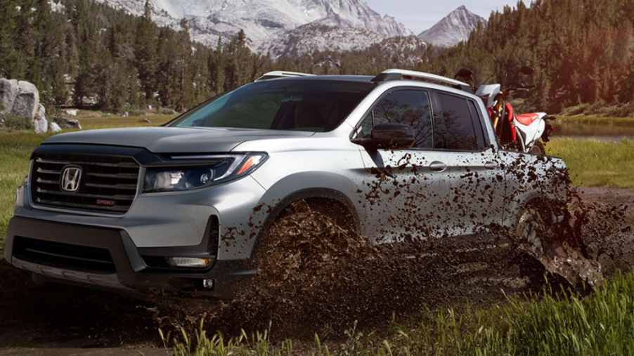 A 2023 Honda Ridgeline drives through mud, could it be a hybrid truck soon?