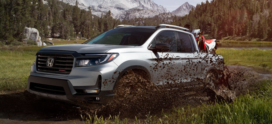 A 2023 Honda Ridgeline drives through mud, could it be a hybrid truck soon?