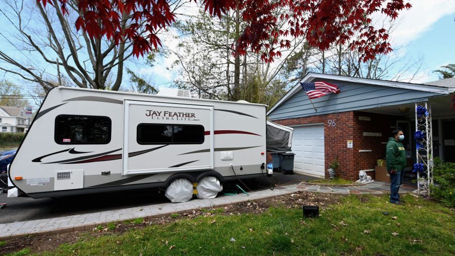 An RV parked in a home driveway in Nutley, New Jersey, which is an example of 'moochdocking'