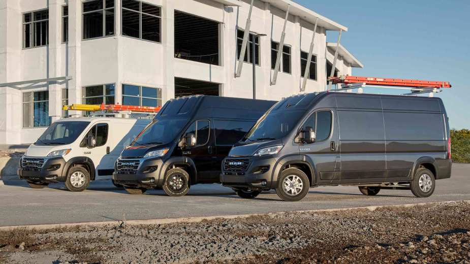 A group of 2023 Ram ProMaster models outside a building.