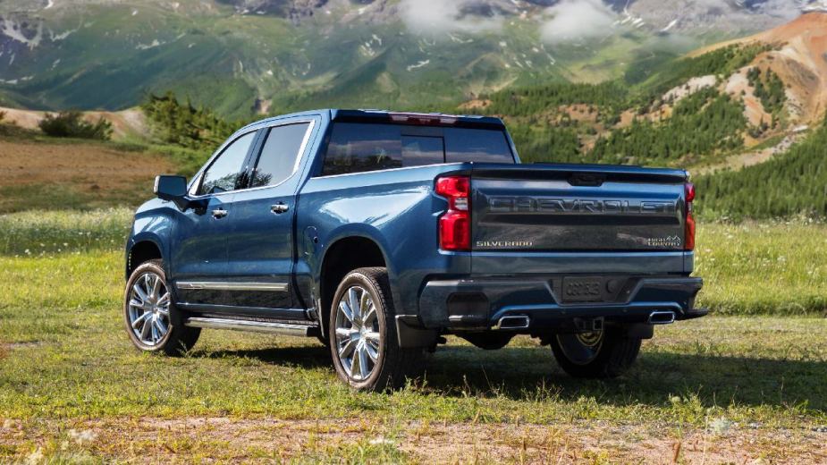 Rear angle view of the blue 2022 Chevy Silverado 1500, the most reliable full-size pickup truck, according to JD Power 