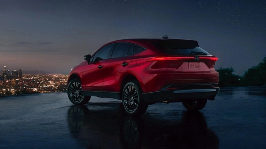Rear angle view of red 2023 Toyota Venza crossover SUV