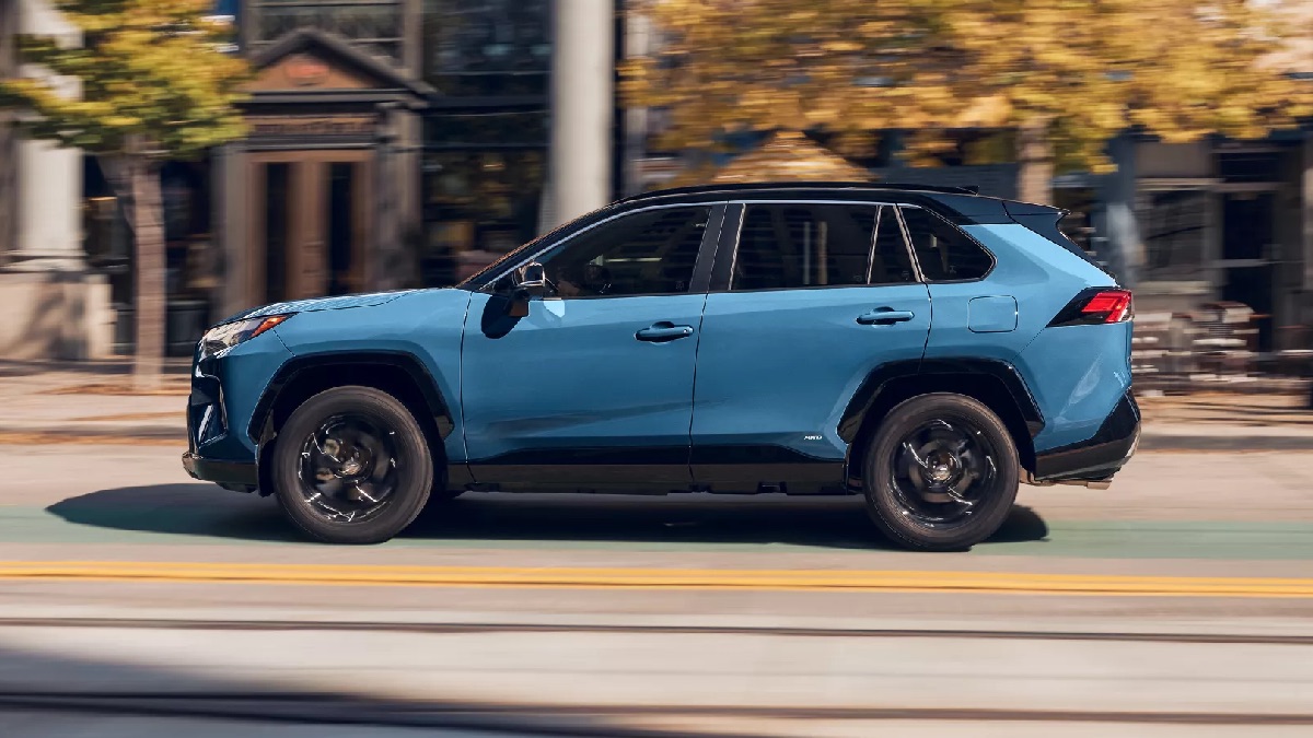 Side view of blue 2022 Toyota RAV4 Hybrid, highlighting why hybrid vehicles get higher fuel economy for city driving