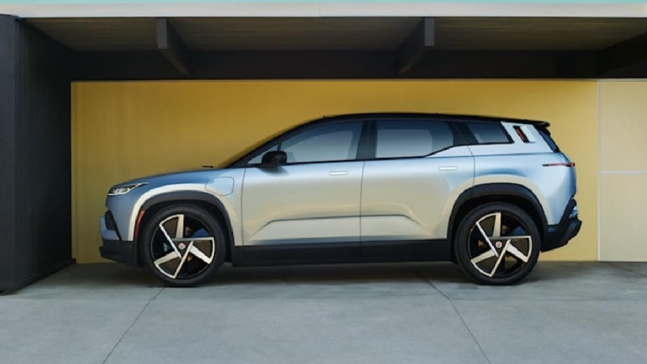 Side view of silver 2023 Fisker Ocean electric crossover SUV, which is cheaper than all Tesla models