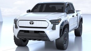 A white 2024 Toyota Tacoma Electric is parked.