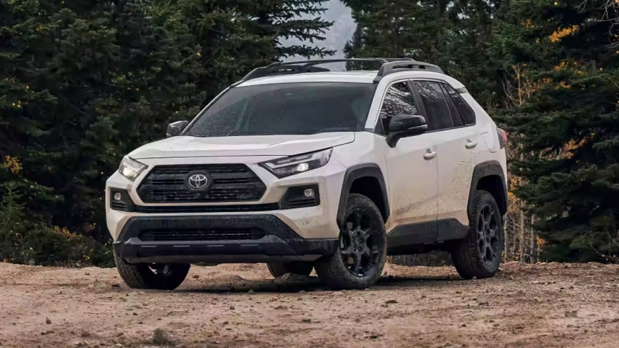 A white Toyota RAV4 TRD Off-Road is parked.