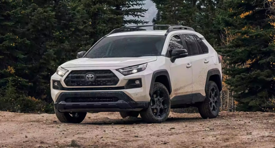 A white Toyota RAV4 TRD Off-Road is parked. 