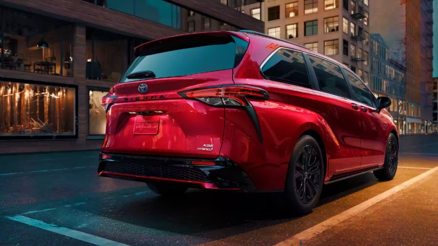 the rear end of a red 2023 Toyota Sienna