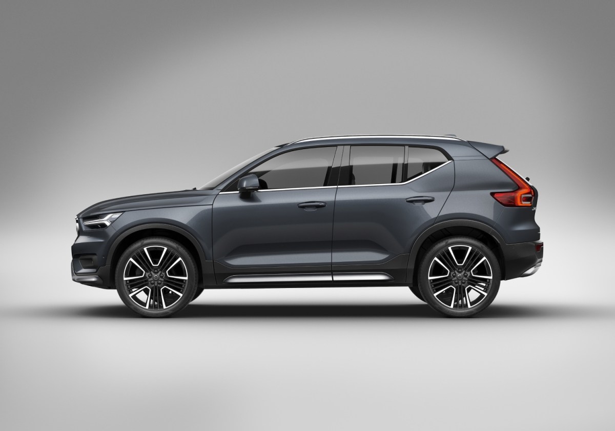 Affordable used SUVs with the most technology include this Volvo XC40, pictured in gray against a silver backdrop. The XC40 is top 10 on the list of the best small luxury SUVs.