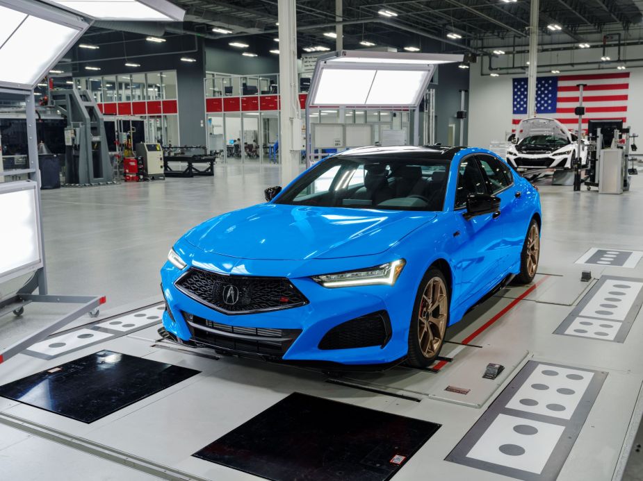 A blue 2023 Acura TLX Type S PMC Edition luxury sedan model assembled at a factory
