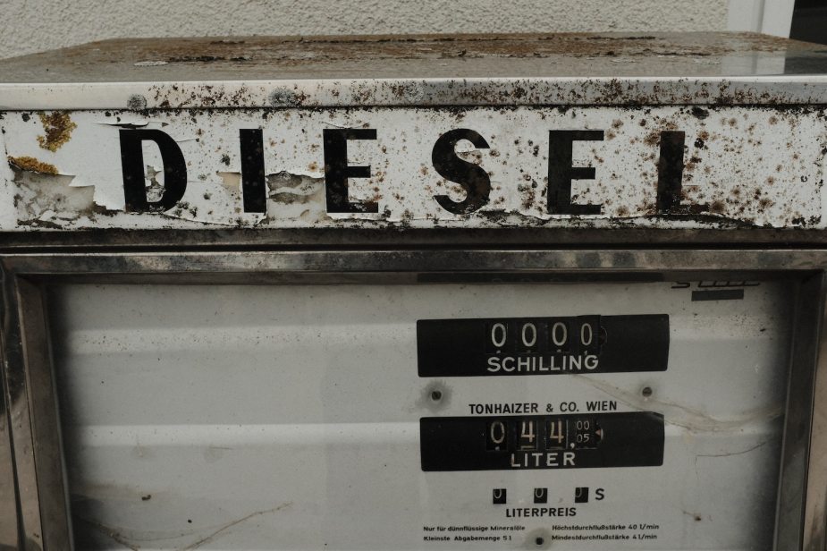 The diesel letters on an old fuel pump, its white paint chipping off.