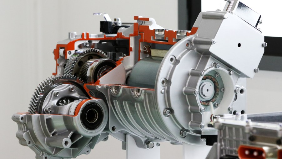 An EV motor with cutaways to show the inner workings of the transmission is shown