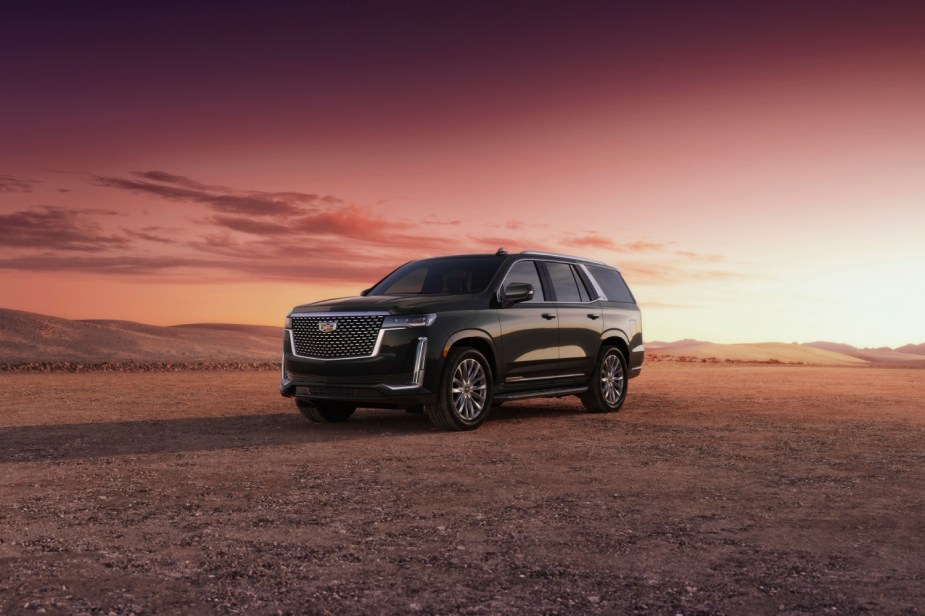 The 2023 Cadillac Escalade V parked in front of a sunset.