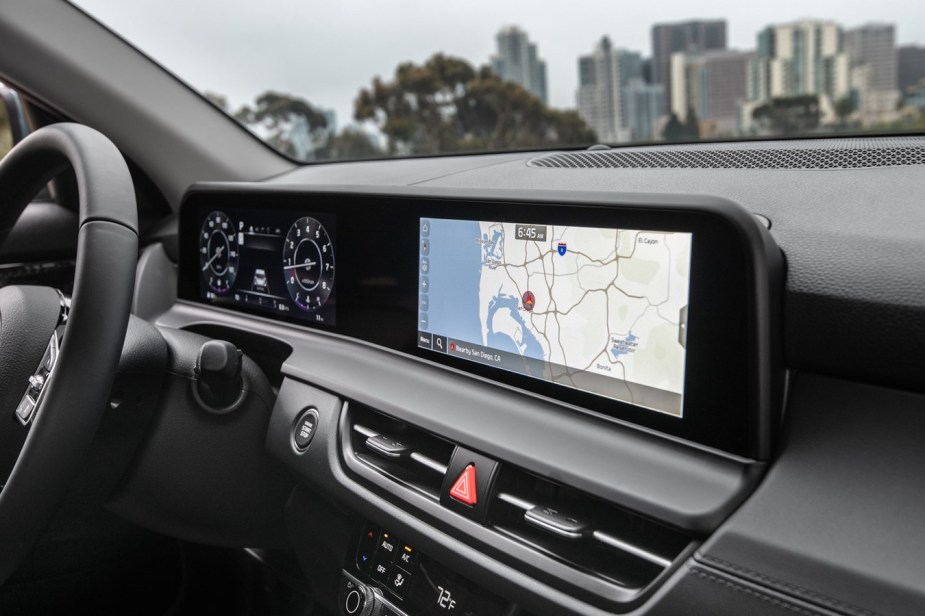 A panoramic screen across the dash of a 2024 Kia Seltos subcompact SUV is a standout feature