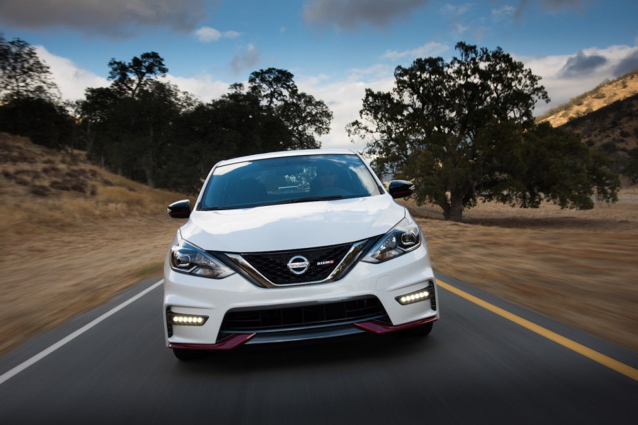 A white 2018 Nissan Sentra NISMO driving