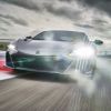 A 2022 Acura NSX Type S luxury sports car model driving on a racetrack under dark clouds