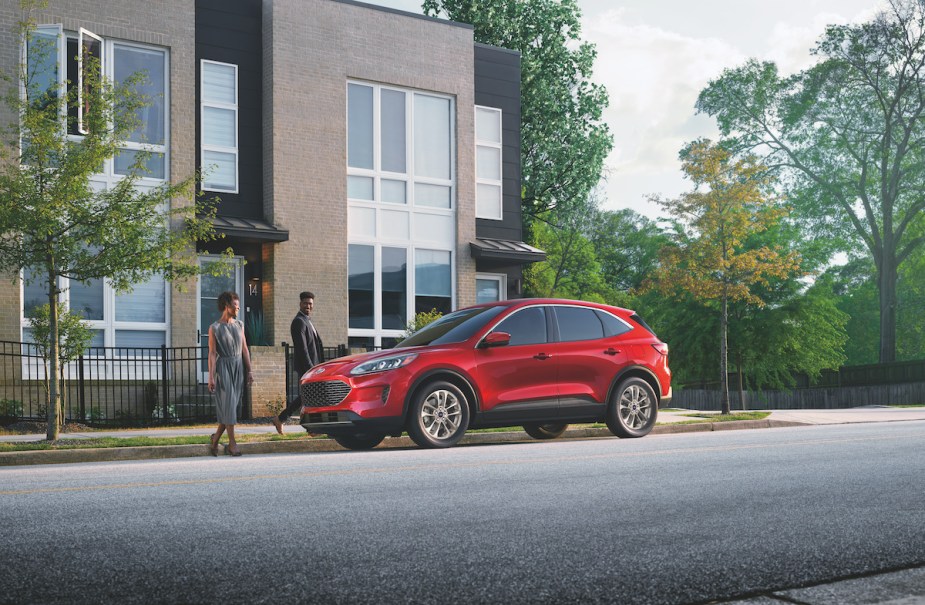 2022 Ford Escape Hybrid parked on the street in front of a building. 