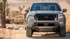 A 2022 Nissan Frontier on display in a desert.
