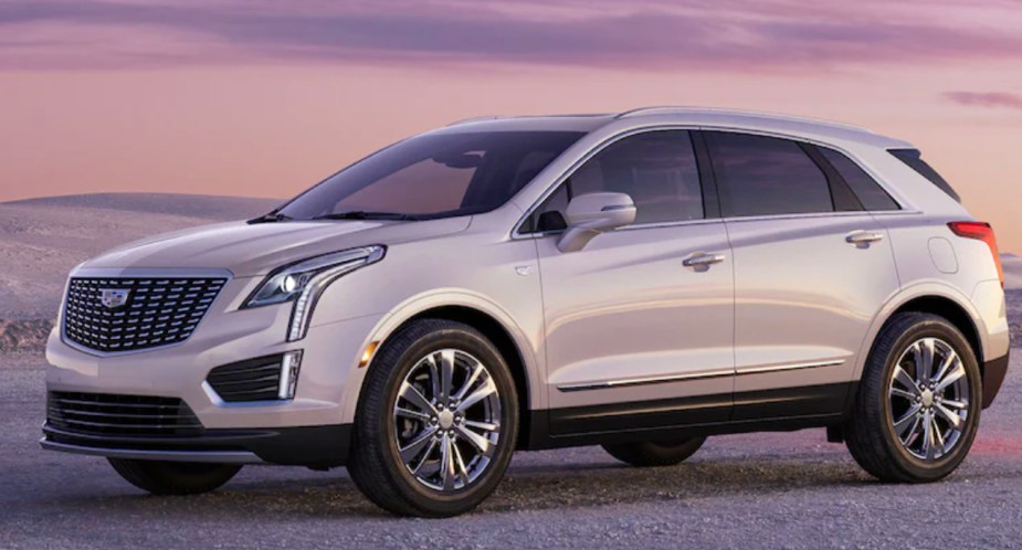 A white 2023 Cadillac XT5 small luxury SUV is parked. 