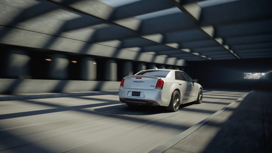 The 2023 Chrysler 300C blasts through a tunnel, showing off its rear styling. 