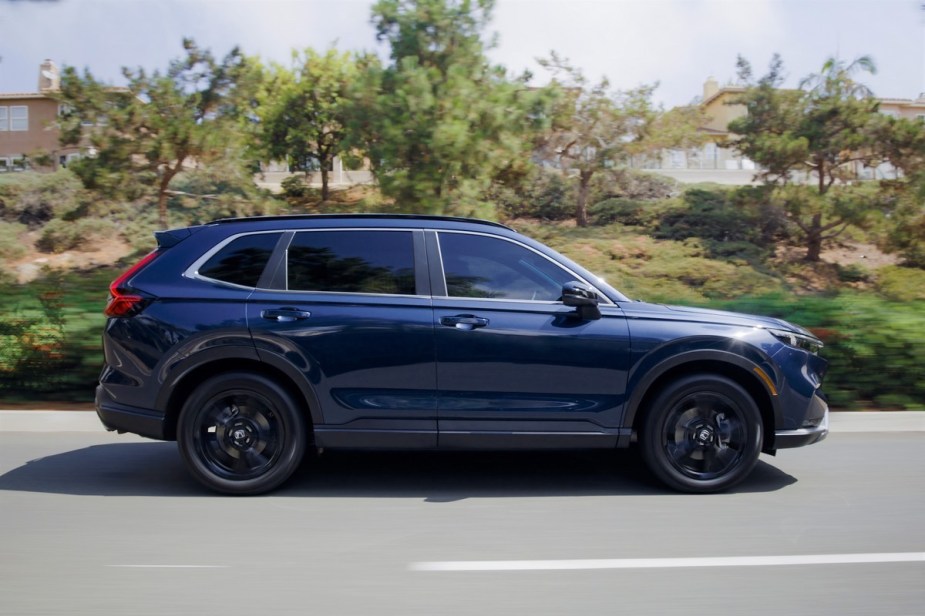 A blue 2023 Honda CR-V driving down the road. There are several things to love about the compact crossover.