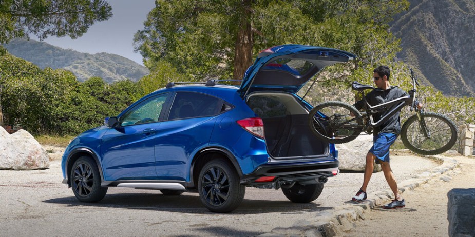 Blue 2023 Honda HR-V on an adventure. This subcompact SUV is large enough for a mountain bike.