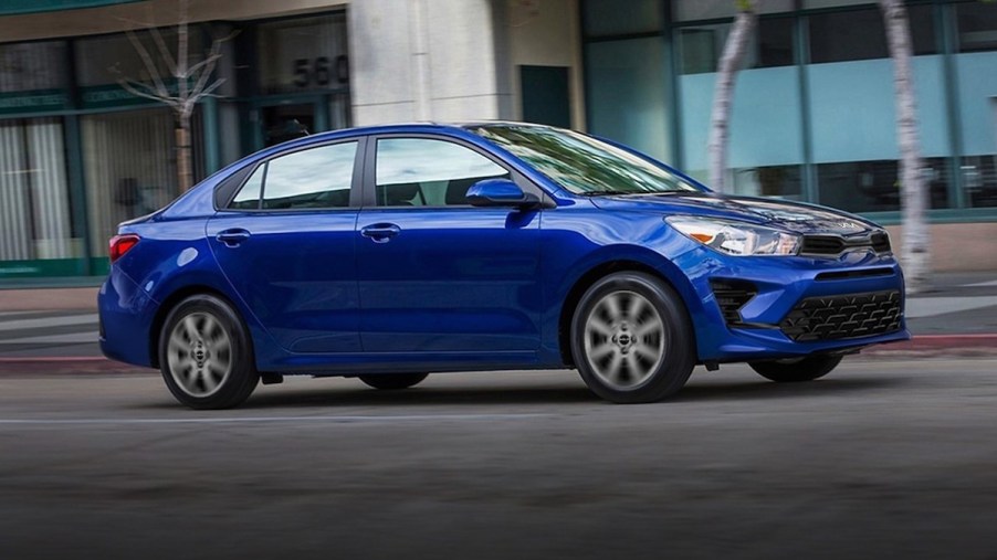 A blue 2023 Kia Rio which has one of the cheapest 5-year ownership costs.