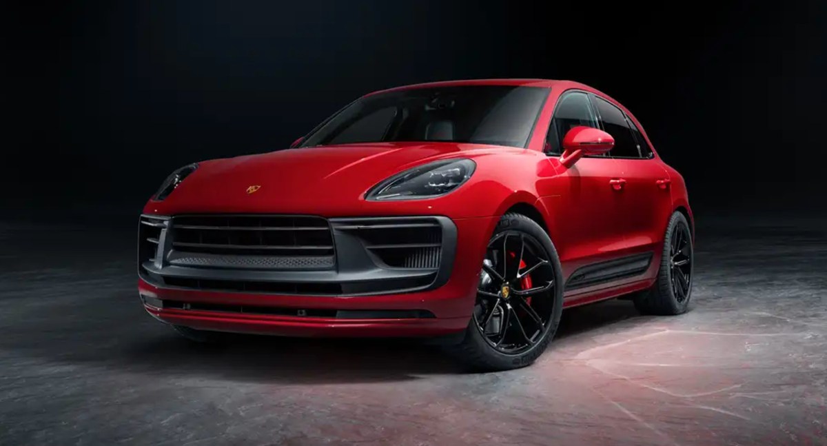 A red 2023 Porsche Macan small luxury SUV is parked.