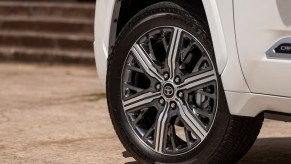 The wheel of a white 2023 Toyota Sequoia with the cheapest 5-year ownership costs.