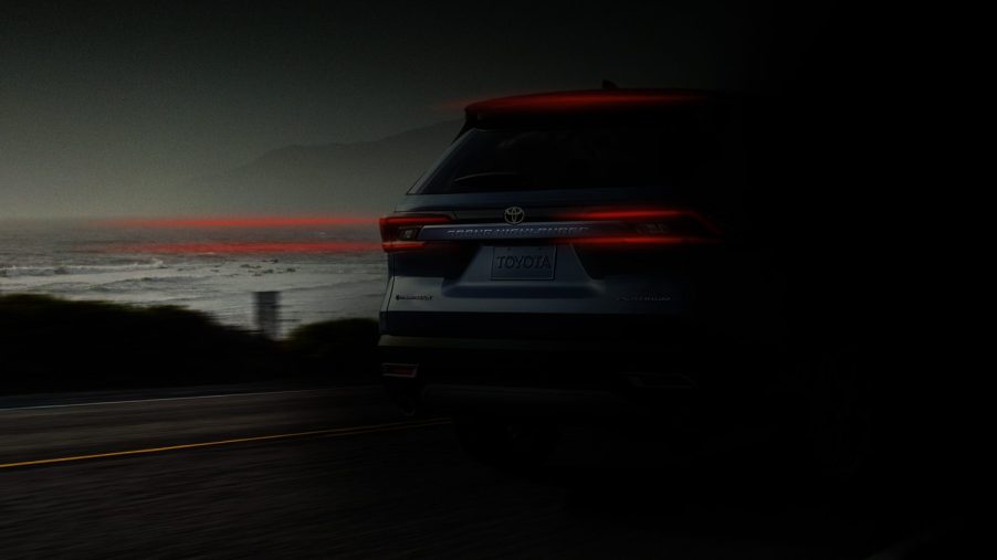 New 2024 Grand Highlander preview parked in the dark at dusk.