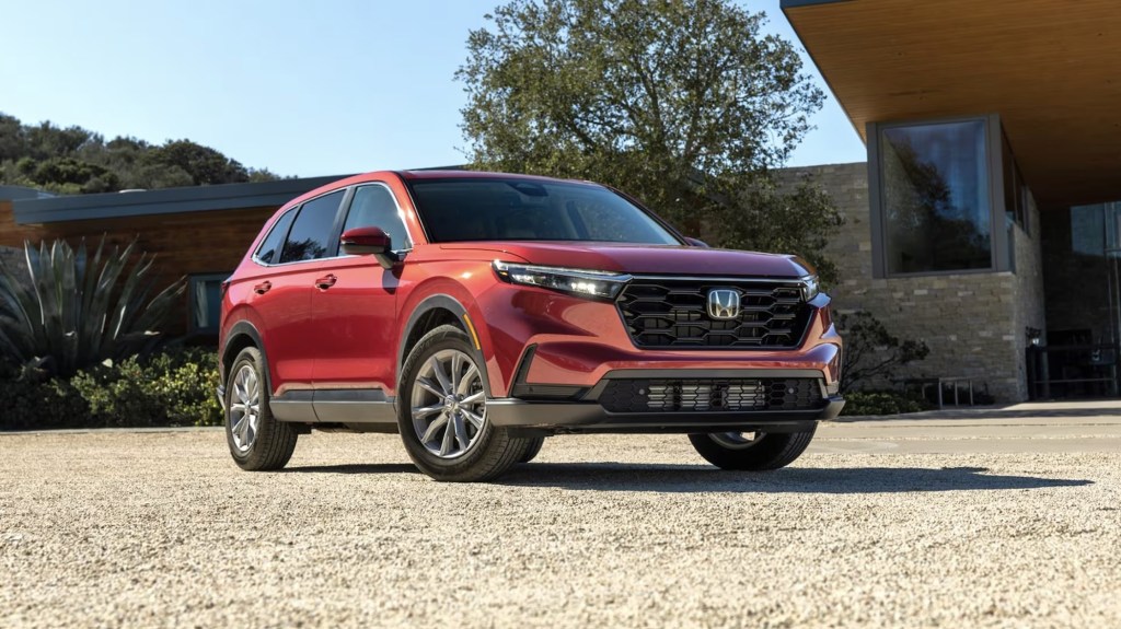 The 2024 Honda CR-V parked near a home