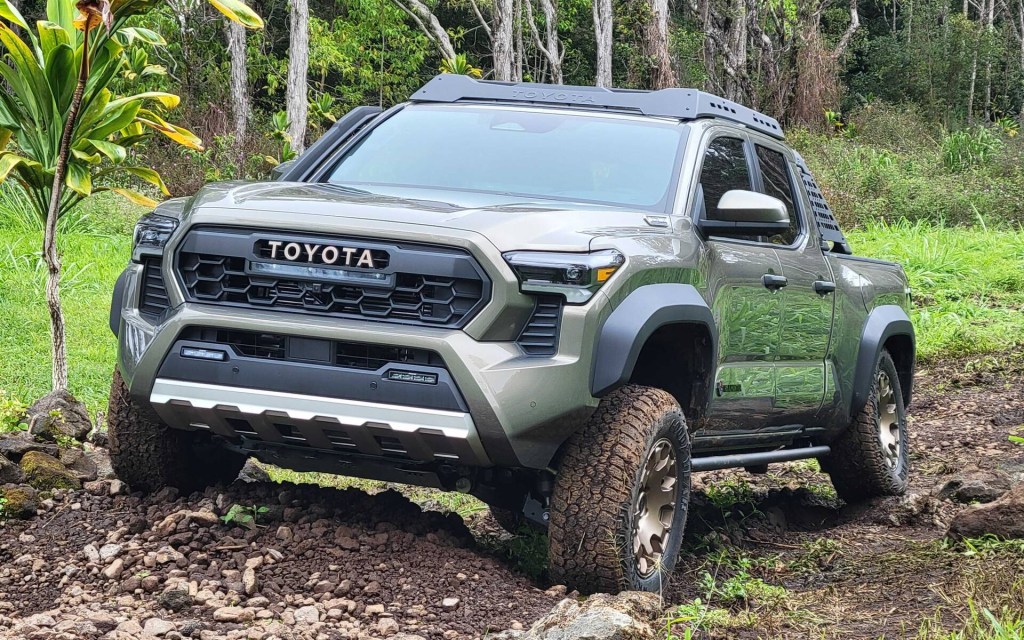 The 2024 Toyota Tacoma Hybrid off-roading in mud