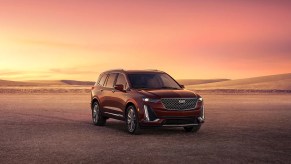 A red 2023 Cadillac XT6, experts agree on the best trim.