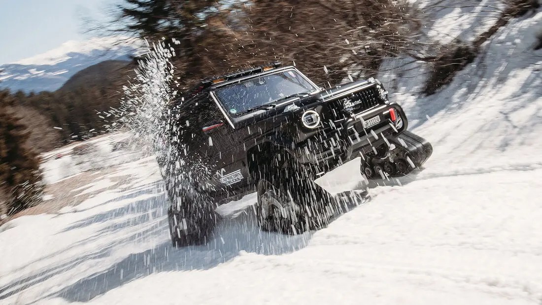 AMG G63 with tank treads in the snow 