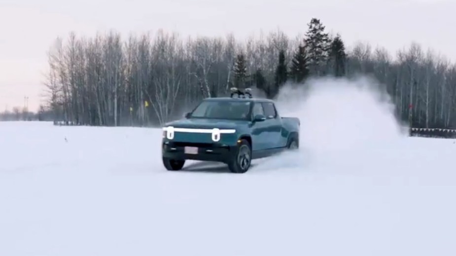 Blue Rivian R1T electric truck in the snow, highlighting how it is the best truck to drive in the snow