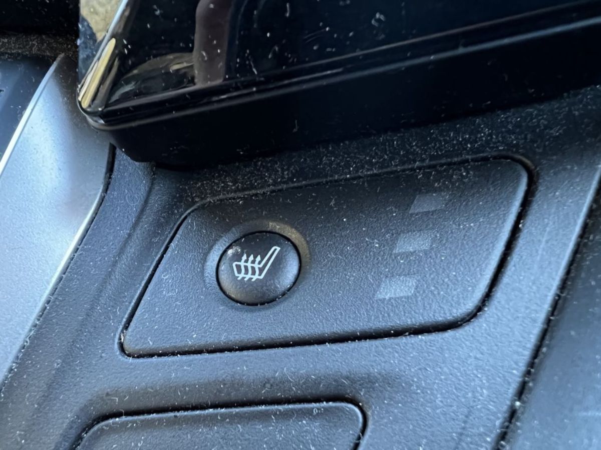 A button to turn on heated seats in a car.