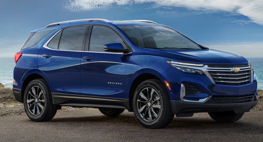 A blue 2023 Chevrolet Equinox small SUV is parked. 