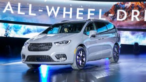 A white Chrysler Pacifica, which is one of the minivans with the most cargo space.