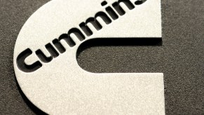 Closeup of a shiny Cummins logo at the company's Waterloo Indiana Army turbo diesel engine factory.