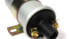 A product photo of a single silver, distributor-type ignition coil.