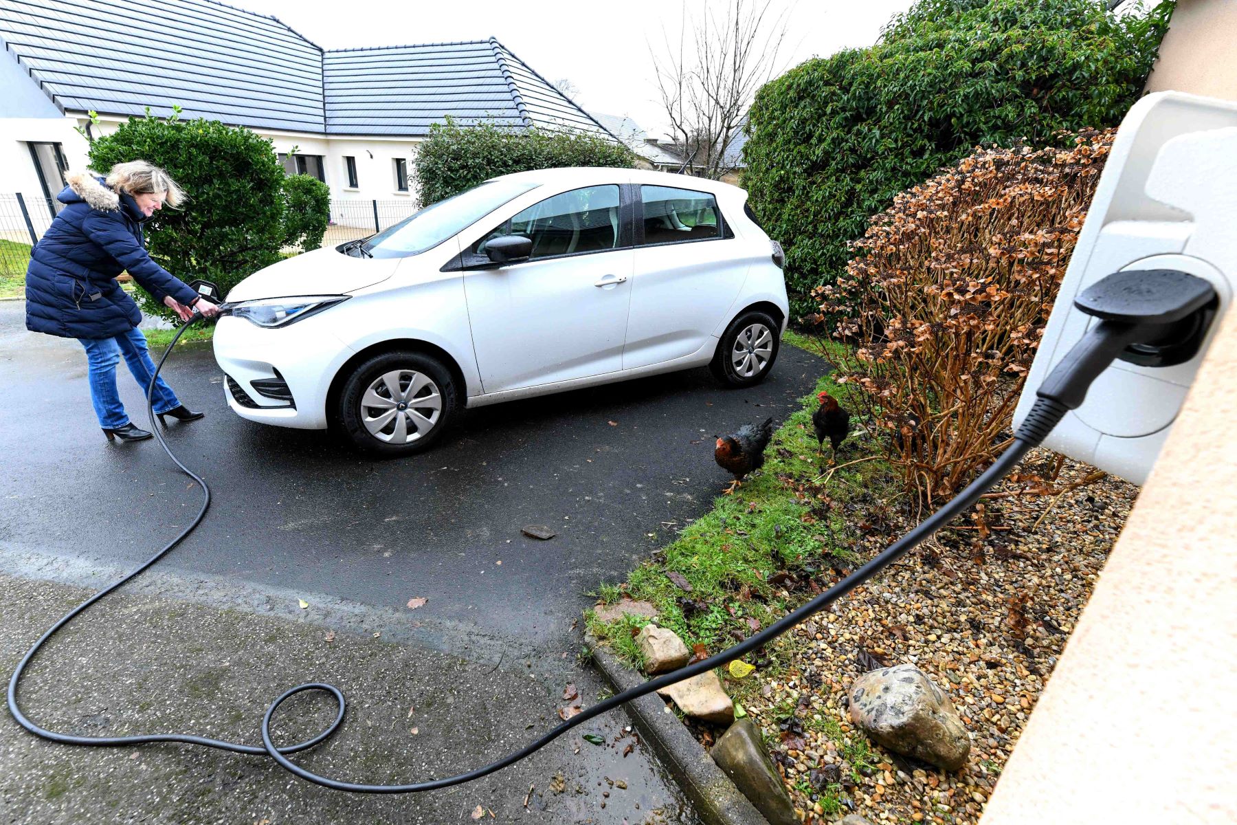 A Renault electric car charging at home using a Level 1 standard outlet