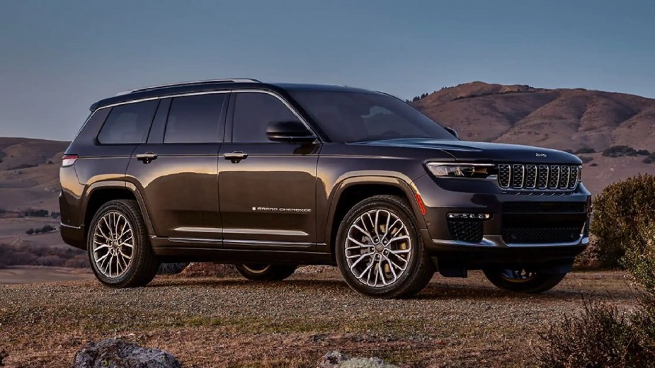 Front angle view of brown 2023 Jeep Grand Cherokee midsize SUV