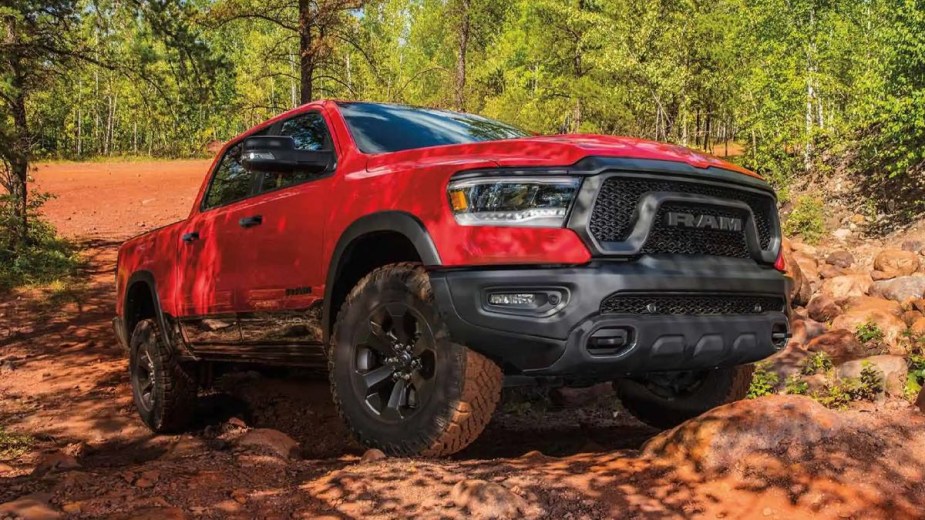 Front angle view of red 2023 Ram 1500, only new full-size pickup truck recommended by Consumer Reports in 2023