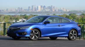 The Honda Civic Coupe, like this blue coupe, is among the Honda cars that are the best for the money.