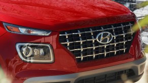 The front of a red 2023 Hyundai Venue subcompact SUV.